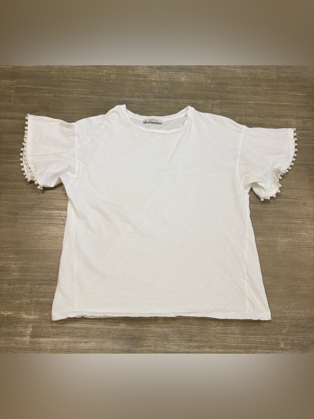 Zara Trafaluc white crewneck top featuring ruffled bell sleeves